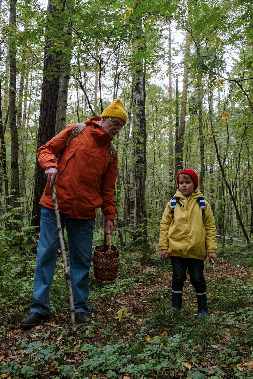 a man spending time with his grandson in a forest